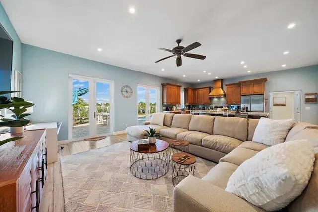 a living room with furniture kitchen and a window