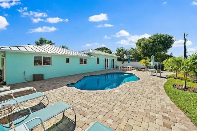 a view of a house with swimming pool