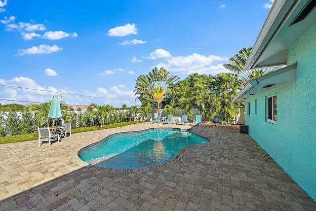 a view of a backyard of a house