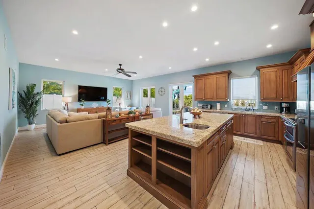 a kitchen with a stove top oven and sink