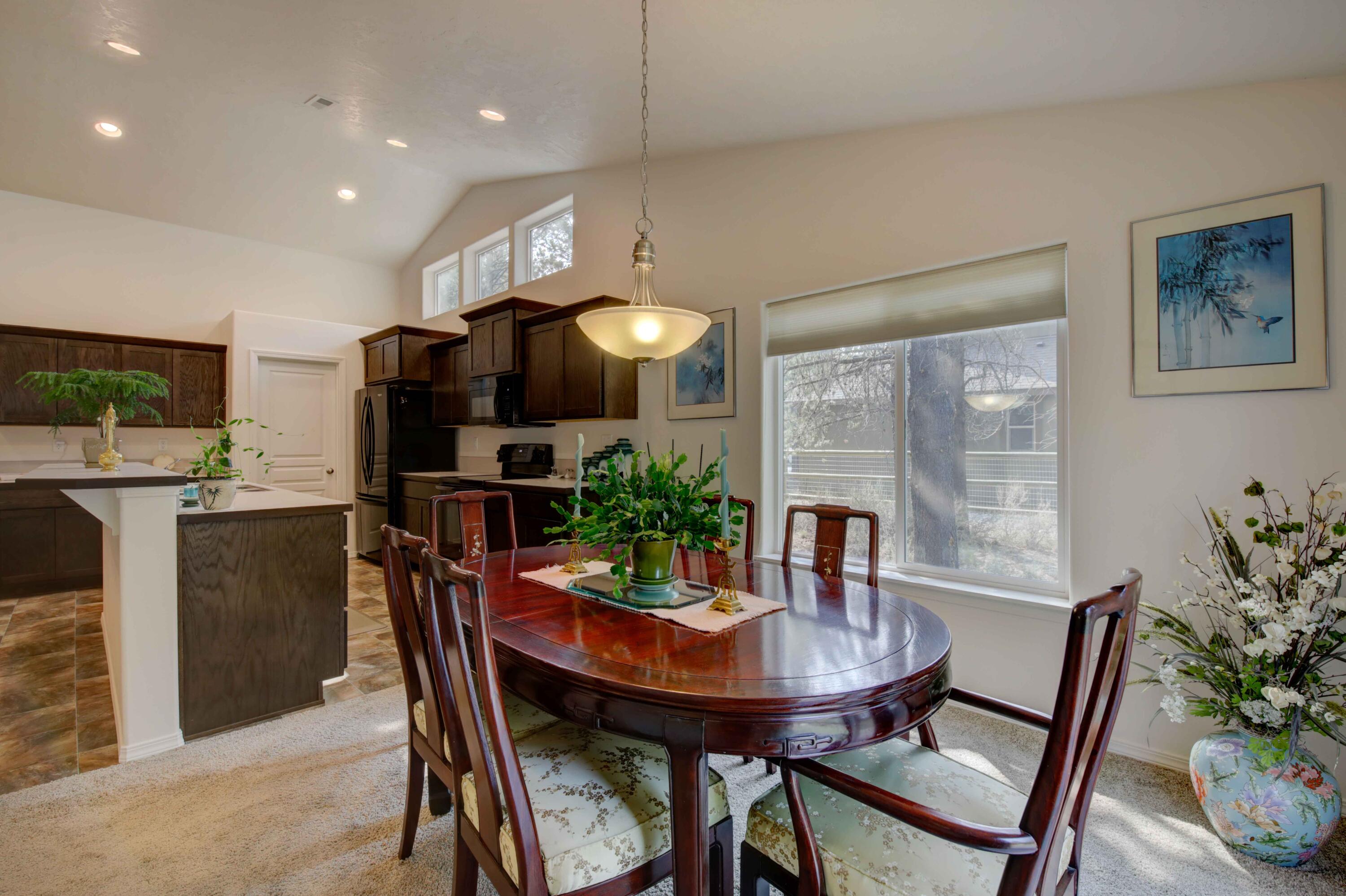 17160 Elsinore Road Bend, OR 97707 - Photo 13 of 47 a view of a dining room with furniture