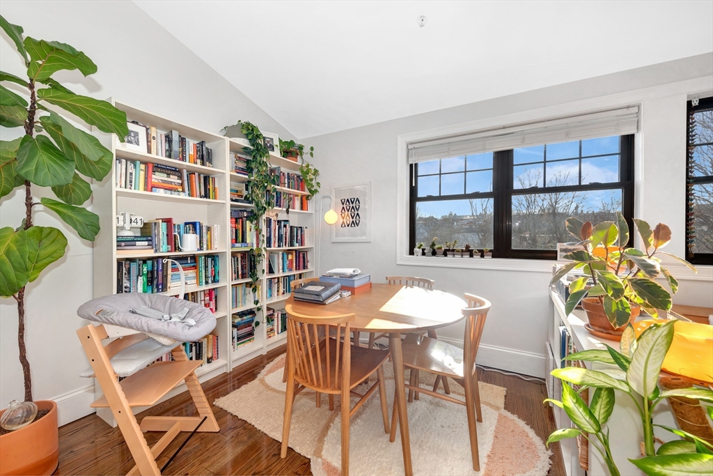 27 Dudley Street Boston, MA 02119 - Photo 10 of 42 a dining room with furniture and a floor to ceiling window