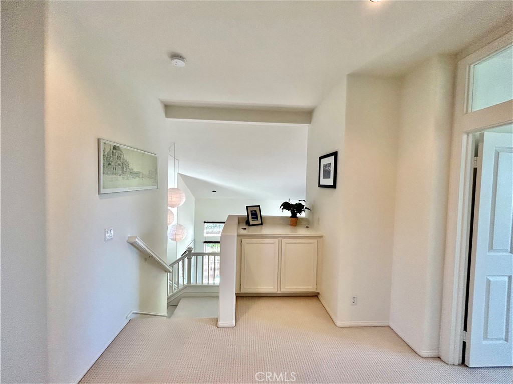 2811 Caponi Place Tustin, CA 92782 - Photo 18 of 50 a kitchen with cabinets and wooden floor