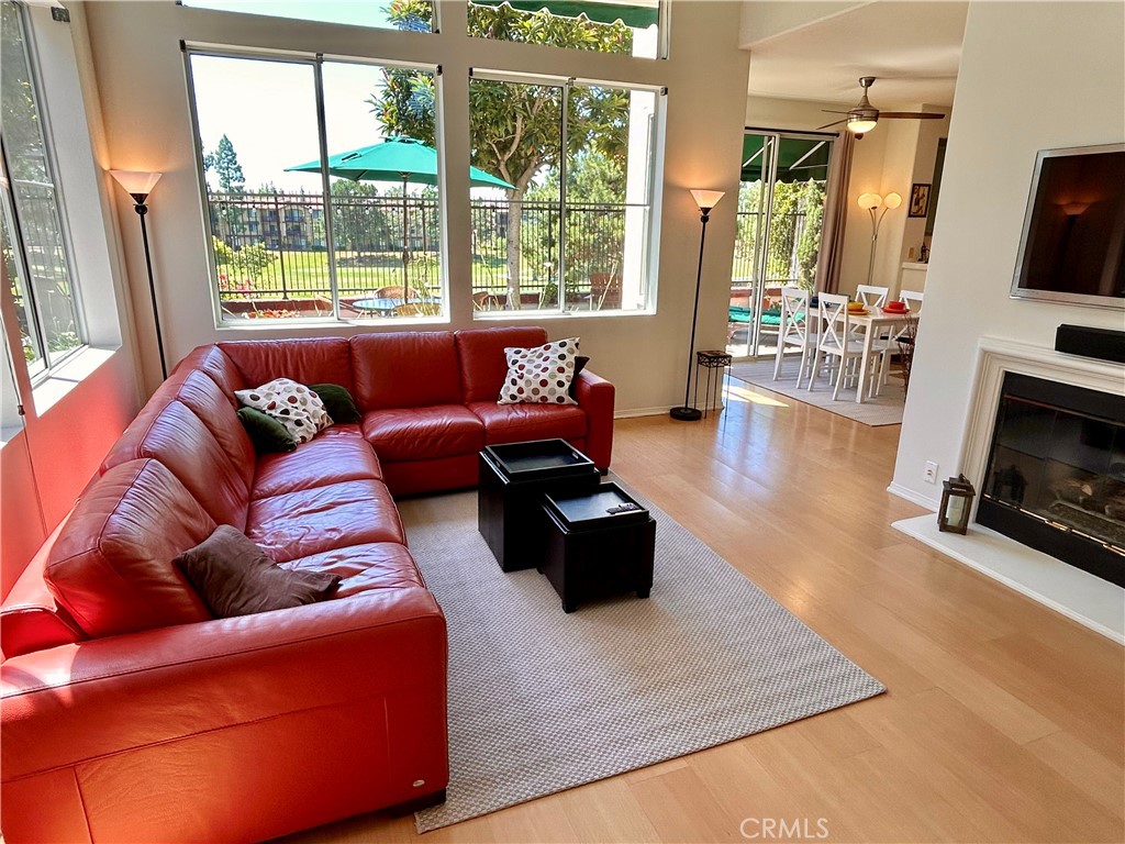 2811 Caponi Place Tustin, CA 92782 - Photo 50 of 50 a living room with furniture fireplace and a flat screen tv