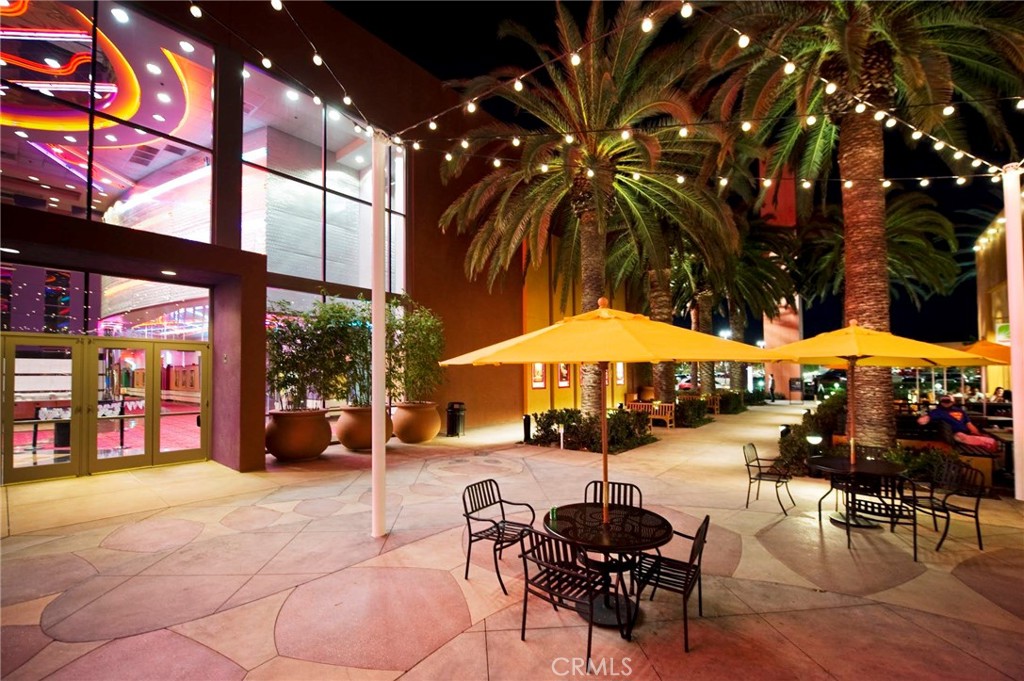 2811 Caponi Place Tustin, CA 92782 - Photo 47 of 50 a patio with a table and chairs and a umbrella