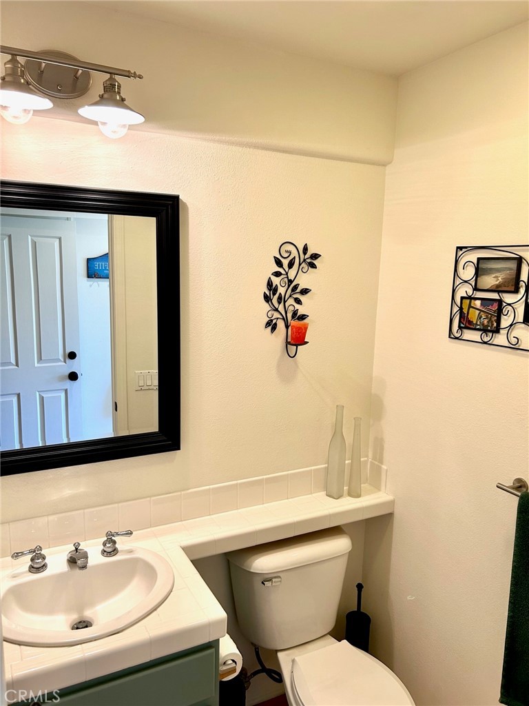 2811 Caponi Place Tustin, CA 92782 - Photo 8 of 50 a bathroom with a sink mirror and toilet
