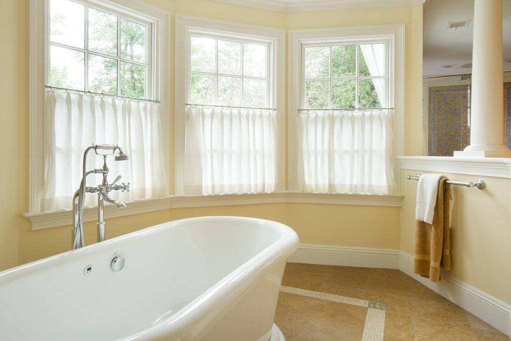 23 Pembroke Road Wellesley, MA 02482 - Photo 12 of 16 a bathroom with bathtub and window