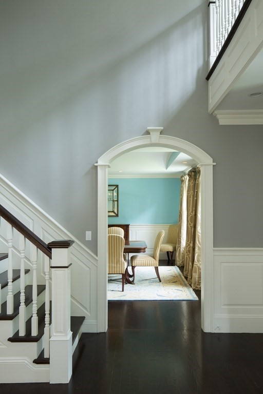 23 Pembroke Road Wellesley, MA 02482 - Photo 3 of 16 a living room with furniture and a chandelier