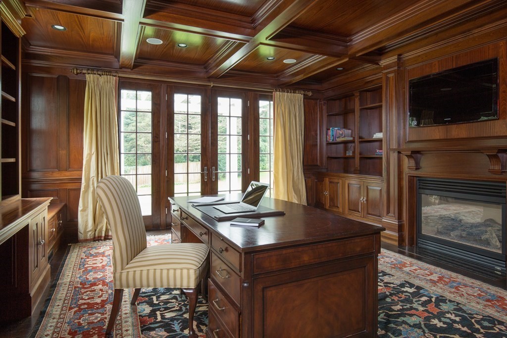 23 Pembroke Road Wellesley, MA 02482 - Photo 5 of 16 a view of a livingroom with furniture and a fireplace