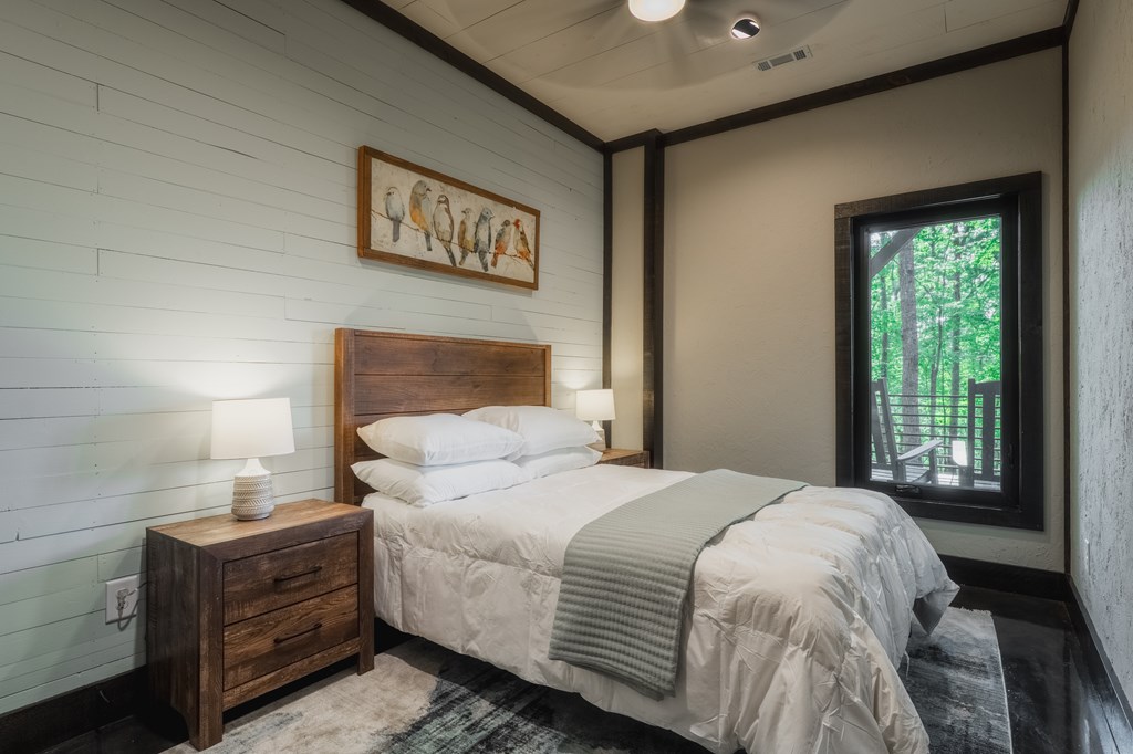 741 Price Road Blue Ridge, GA 30513 - Photo 43 of 58 a bedroom with a large bed and a window