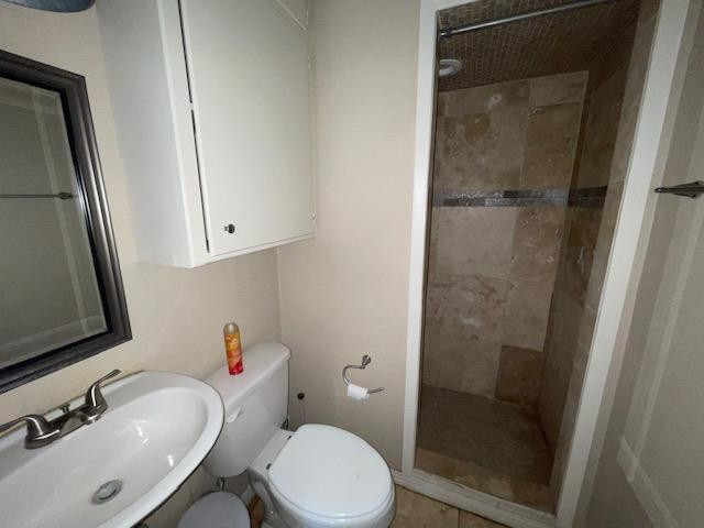 4119 32nd Street, Unit REAR Lubbock, TX 79410 - Photo 7 of 9 a bathroom with a sink and a mirror