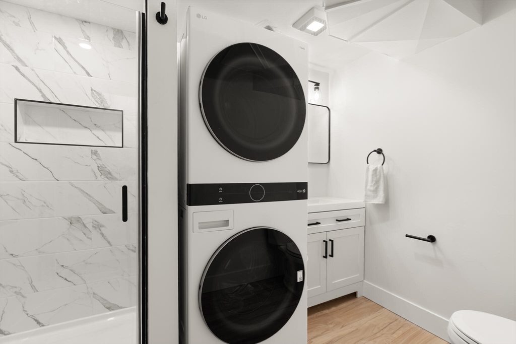 77 Morton Street Canton, MA 02021 - Photo 18 of 28 a view of a hallway with washer and dryer