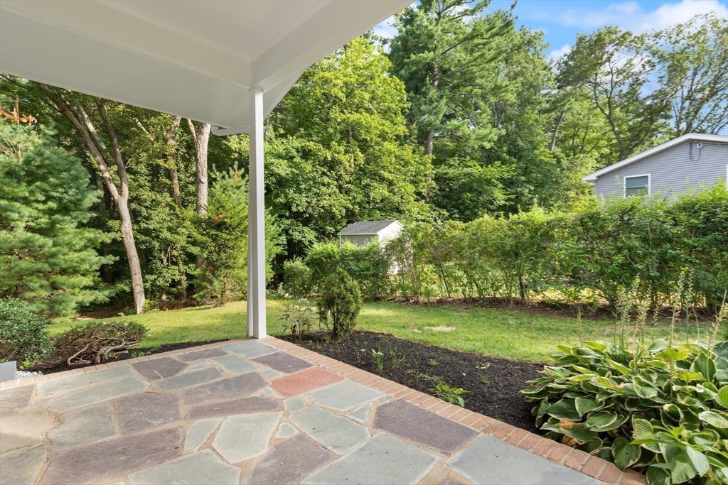 77 Morton Street Canton, MA 02021 - Photo 21 of 28 a view of a garden with a fountain