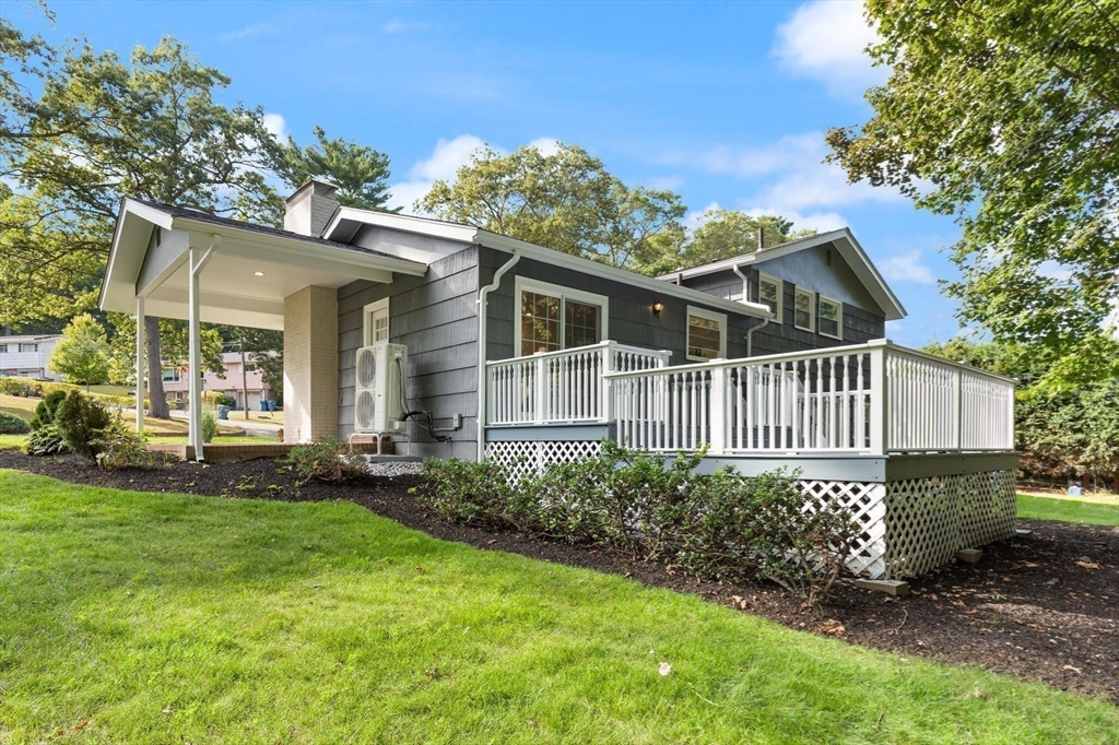 77 Morton Street Canton, MA 02021 - Photo 23 of 28 a view of a house with a yard and potted plants