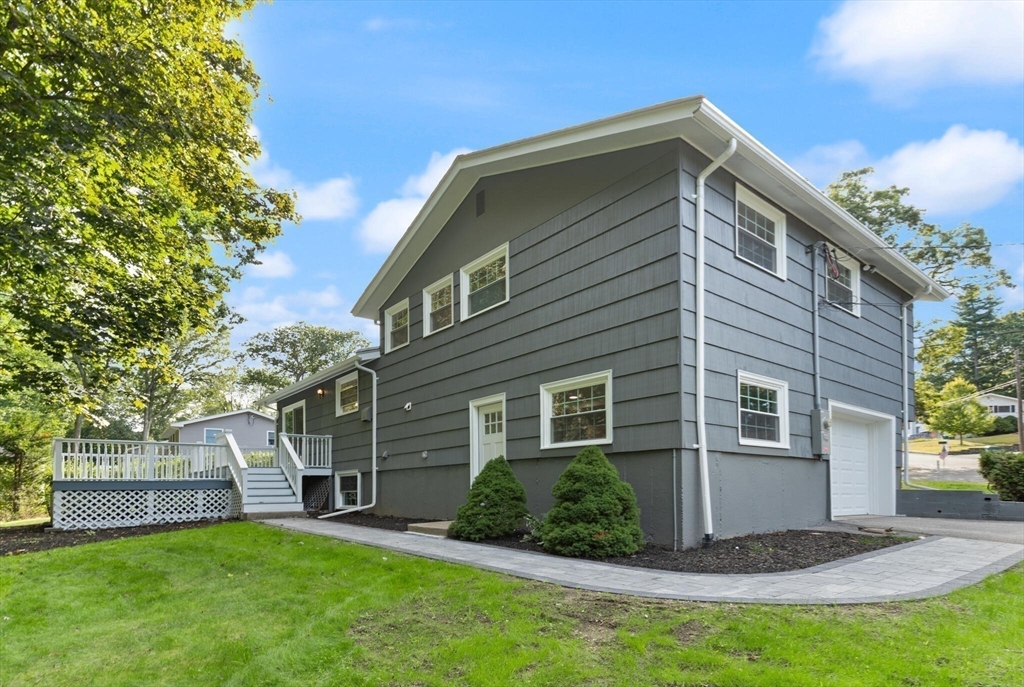 77 Morton Street Canton, MA 02021 - Photo 24 of 28 a front view of a house with a yard