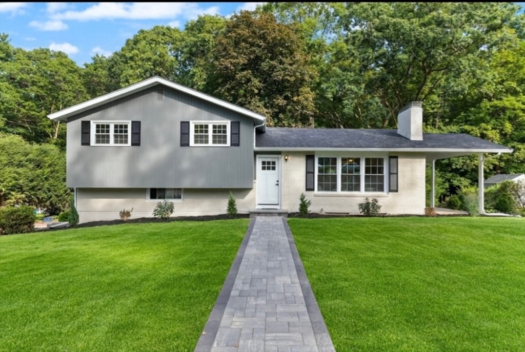 77 Morton Street Canton, MA 02021 - Photo 3 of 28 a front view of a house with a yard