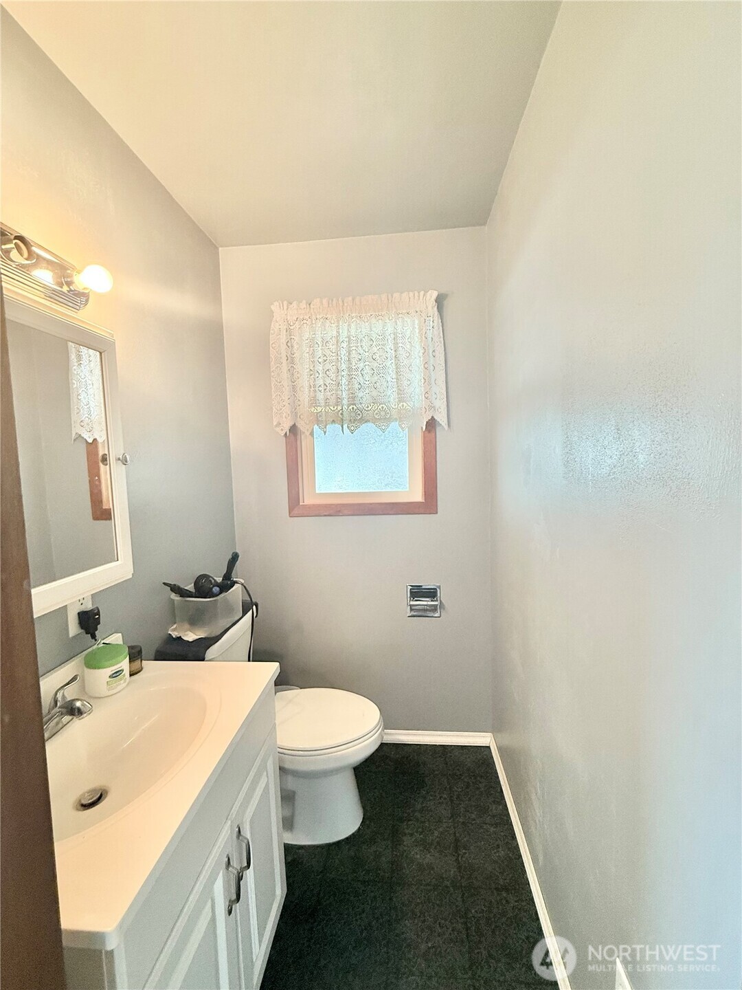 965 3rd Avenue North Okanogan, WA 98840 - Photo 24 of 26 a bathroom with a sink and a mirror