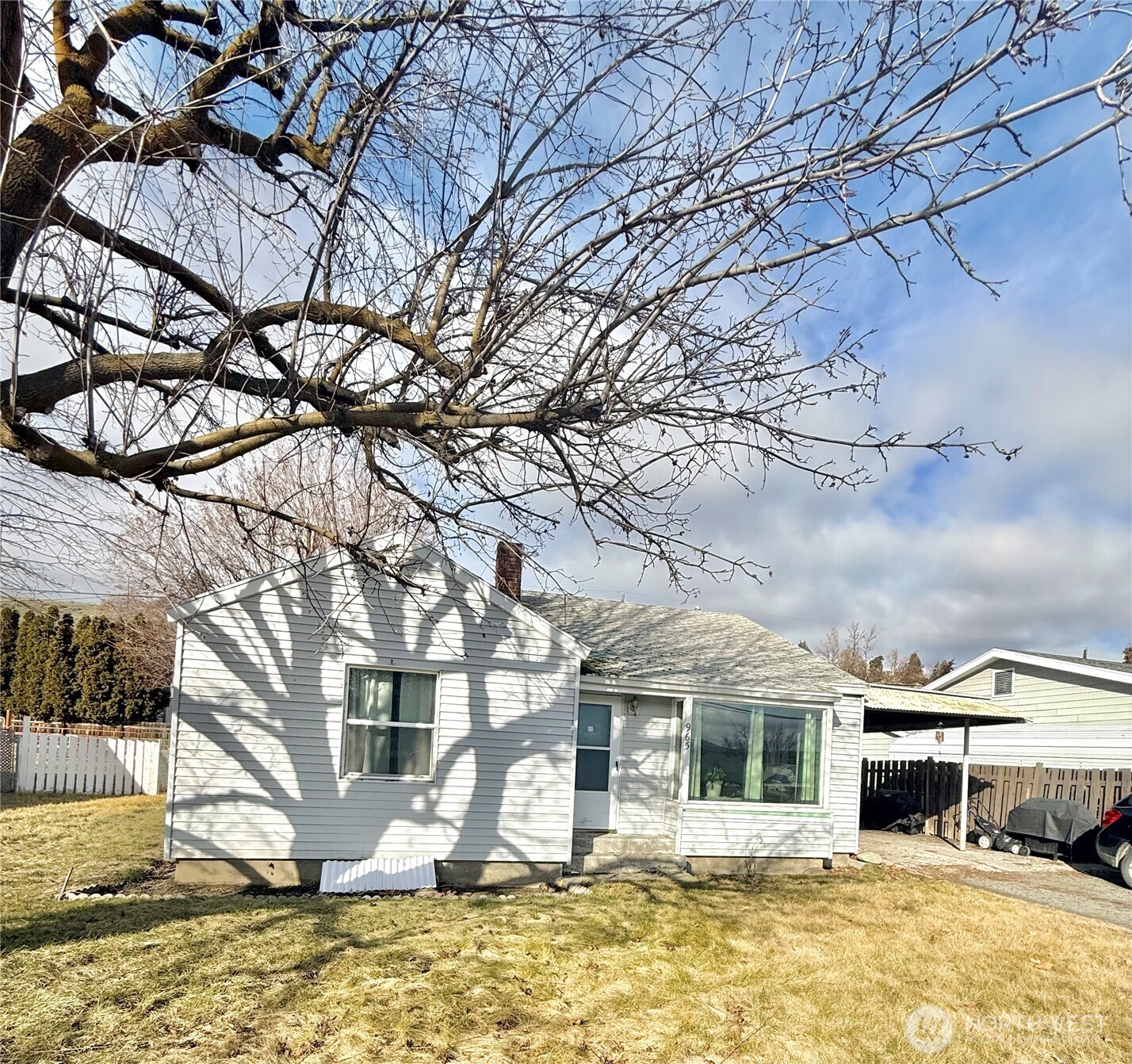 965 3rd Avenue North Okanogan, WA 98840 - Photo 3 of 26 a front view of a house with a yard covered with snow