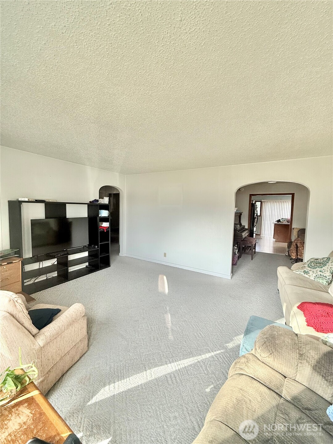 965 3rd Avenue North Okanogan, WA 98840 - Photo 7 of 26 a living room with furniture and a flat screen tv