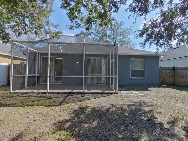 a house with trees in the background