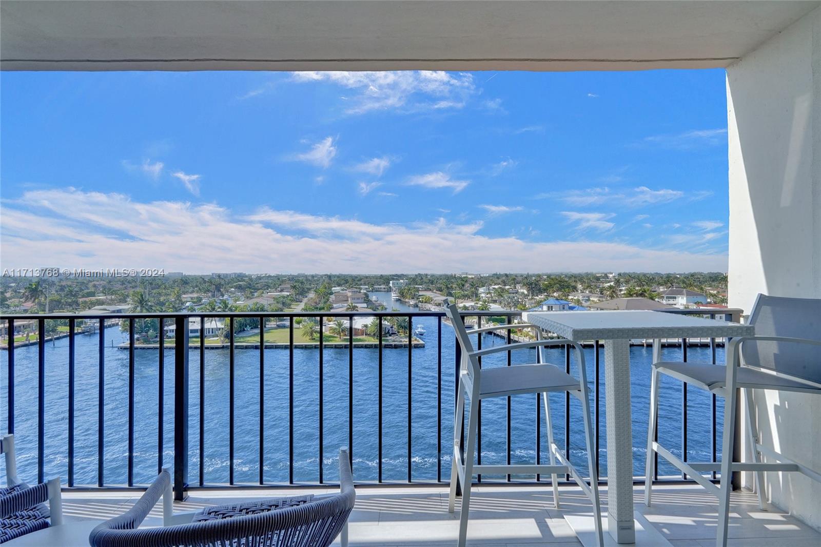 521 North Riverside Drive, Unit 705 Pompano Beach, FL 33062 - Photo 2 of 55 a view of a balcony with a table