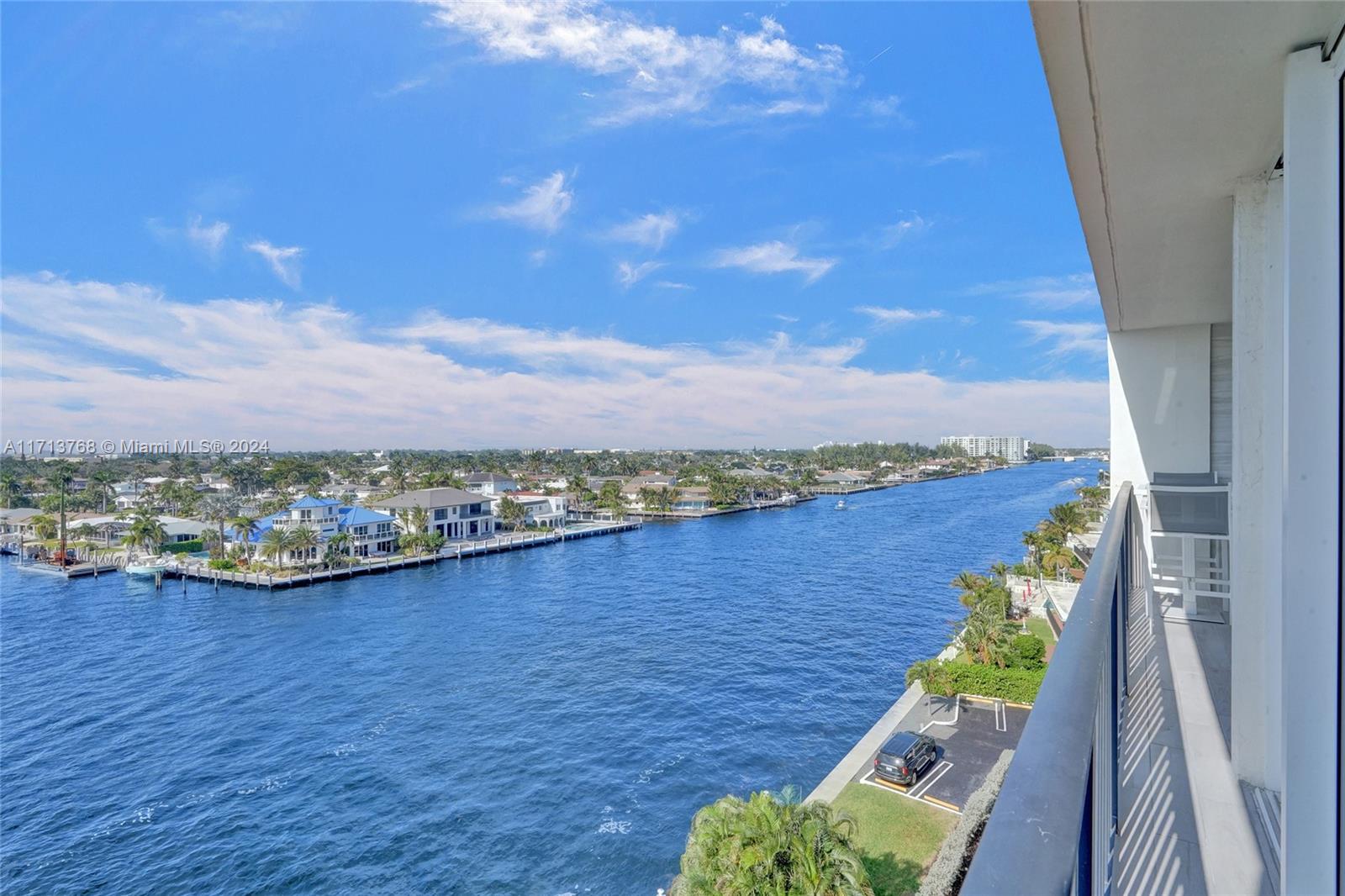 521 North Riverside Drive, Unit 705 Pompano Beach, FL 33062 - Photo 31 of 55 a view of a terrace with wooden floor and a floor to ceiling window