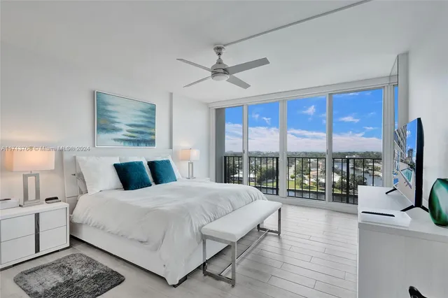 a spacious bedroom with a bed and a desk