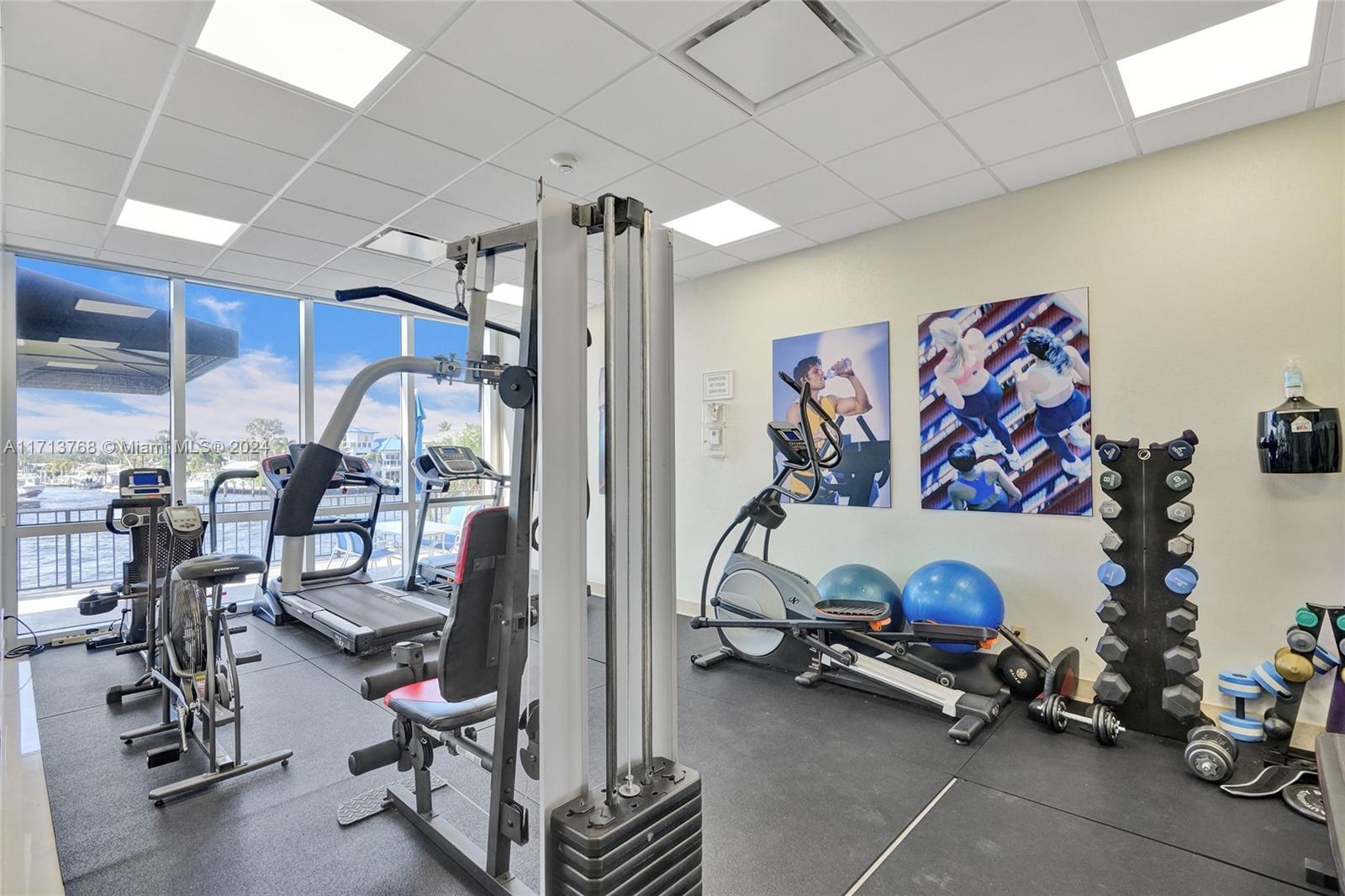 521 North Riverside Drive, Unit 705 Pompano Beach, FL 33062 - Photo 43 of 55 a view of a room with gym equipment