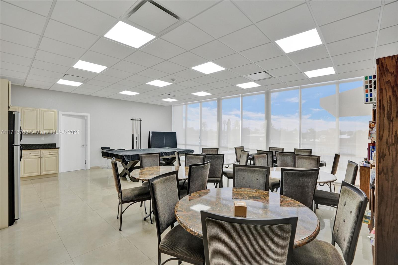 521 North Riverside Drive, Unit 705 Pompano Beach, FL 33062 - Photo 45 of 55 a view of a dining room with furniture window and outside view