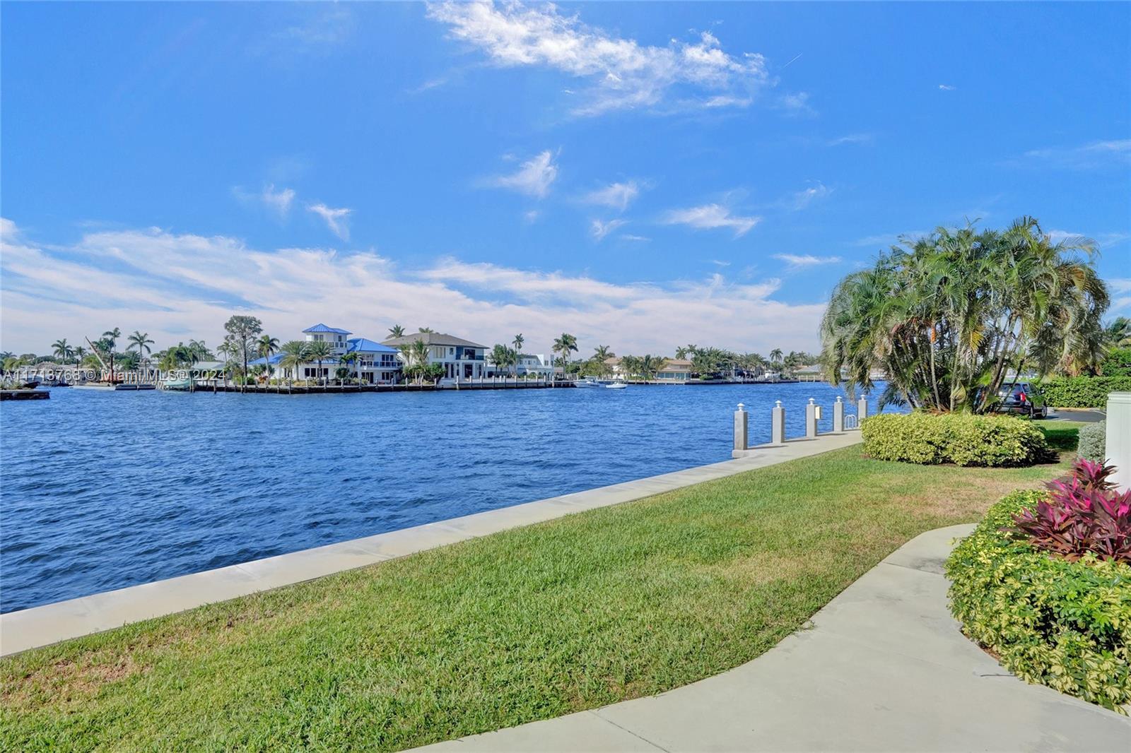 521 North Riverside Drive, Unit 705 Pompano Beach, FL 33062 - Photo 51 of 55 a view of a lake with houses in the back