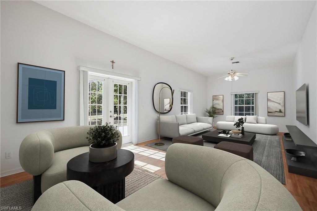 5348 Cypress Lane Naples, FL 34113 - Photo 4 of 28 a living room with furniture potted plant and couches