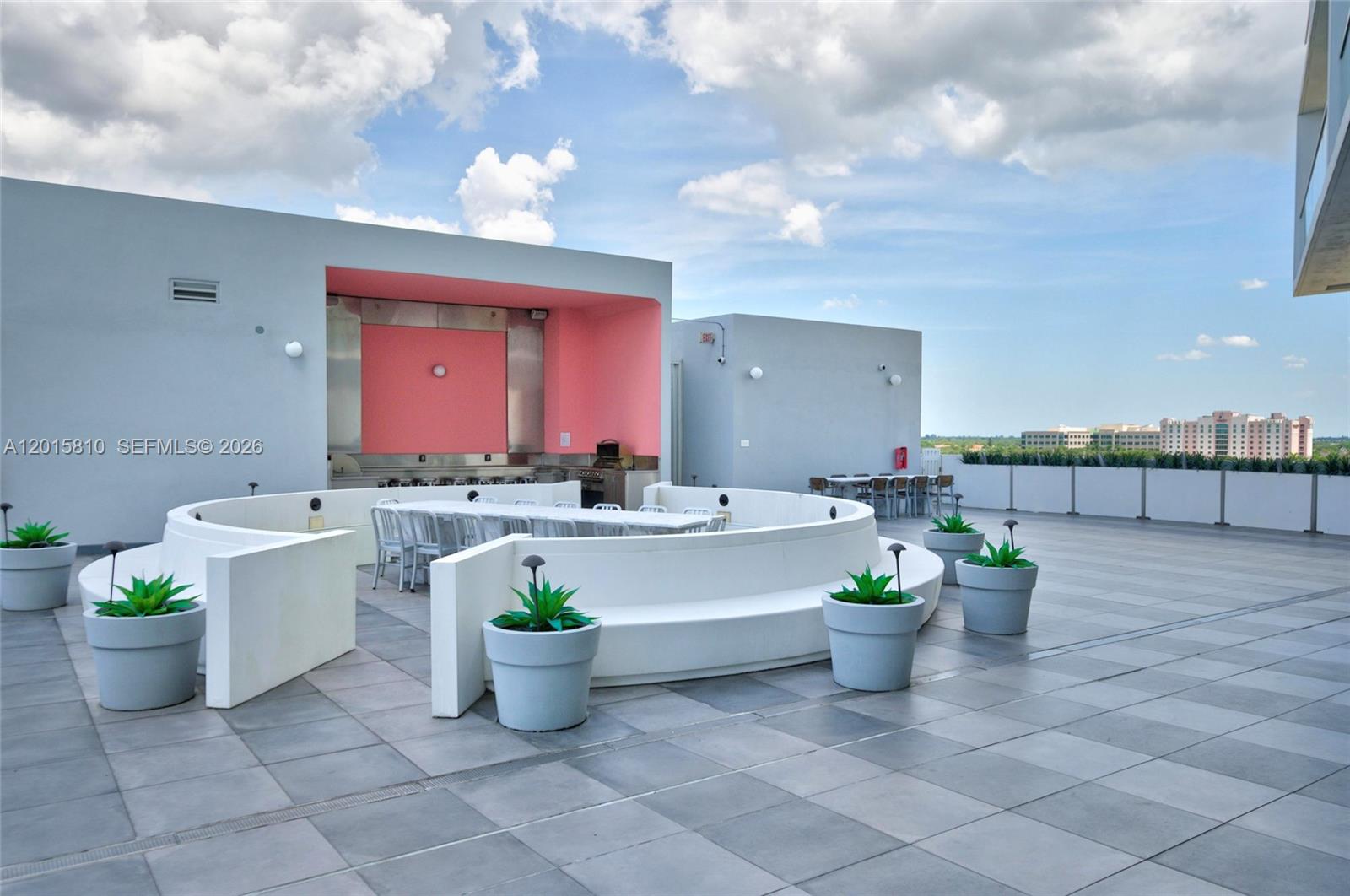 2000 Metropica Way, Unit 1902 Sunrise, FL 33323 - Photo 33 of 40 a view of a patio with couches and potted plants