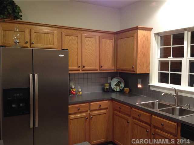 1722 Fletcher Broome Road Monroe, NC 28112 - Photo 12 of 15 a kitchen with stainless steel appliances granite countertop a refrigerator and a sink