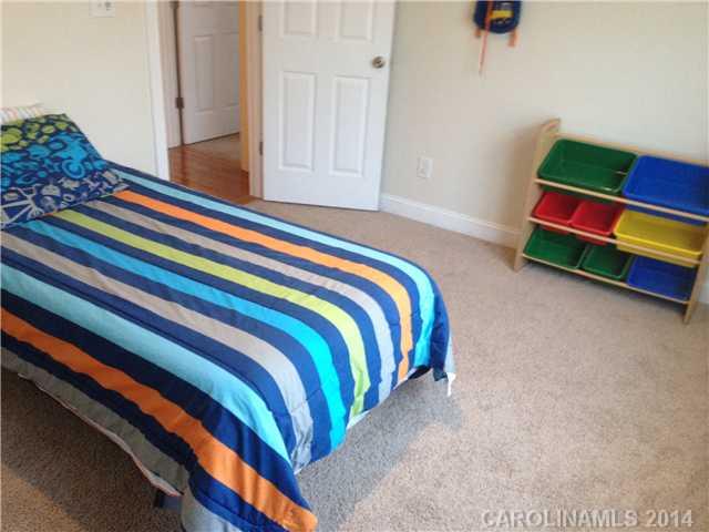 1722 Fletcher Broome Road Monroe, NC 28112 - Photo 13 of 15 a bedroom with a bed and a dresser