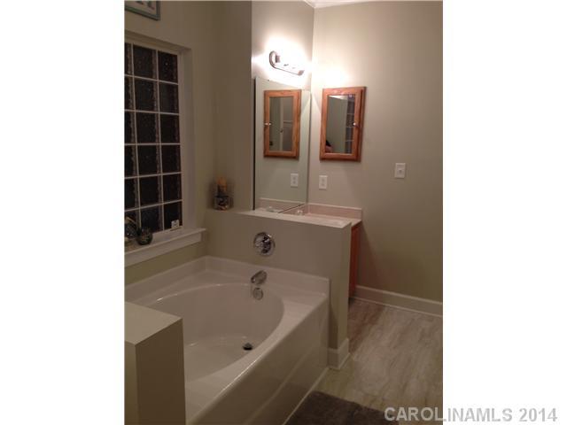 1722 Fletcher Broome Road Monroe, NC 28112 - Photo 6 of 15 a bathroom with a bathtub sink and mirror