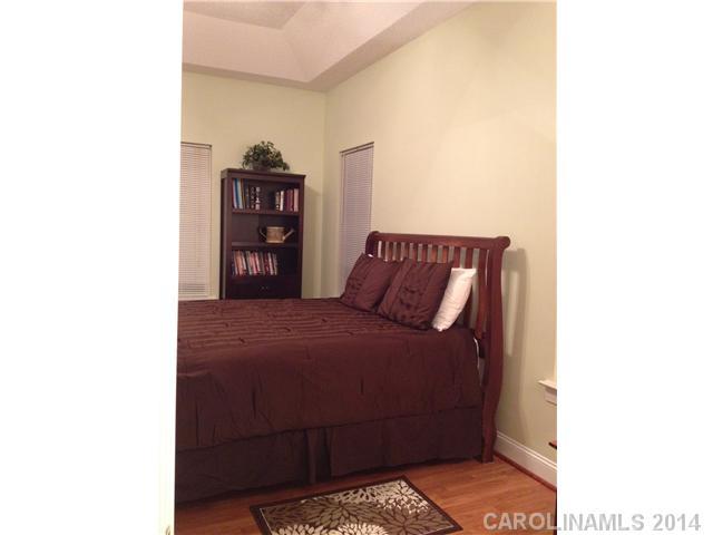 1722 Fletcher Broome Road Monroe, NC 28112 - Photo 7 of 15 a bedroom with a bed and a book shelf