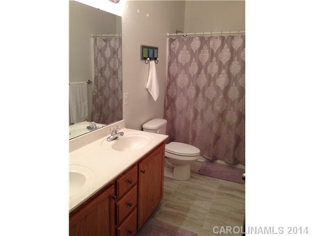 1722 Fletcher Broome Road Monroe, NC 28112 - Photo 9 of 15 a bathroom with a sink a toilet and shower