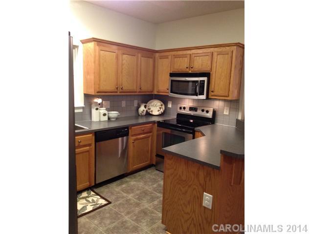 1722 Fletcher Broome Road Monroe, NC 28112 - Photo 10 of 15 a kitchen with a sink cabinets and stainless steel appliances