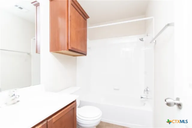 a bathroom with a toilet a sink and a bathtub