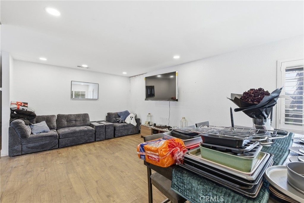 610 South Olive Avenue Rialto, CA 92376 - Photo 14 of 44 a living room with furniture and a flat screen tv