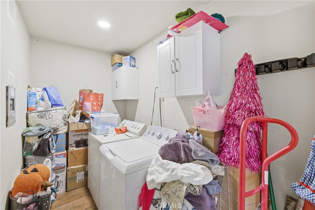 610 South Olive Avenue Rialto, CA 92376 - Photo 18 of 44 a bed room with a bed and a chandelier