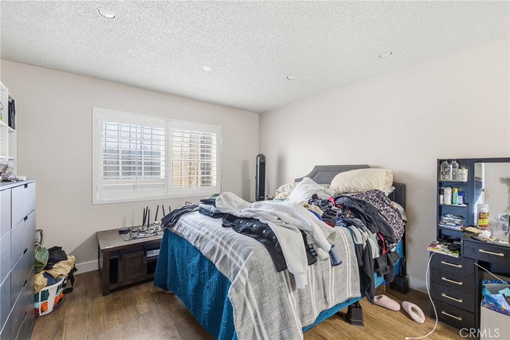 610 South Olive Avenue Rialto, CA 92376 - Photo 19 of 44 a bed sitting in a bedroom next to a window