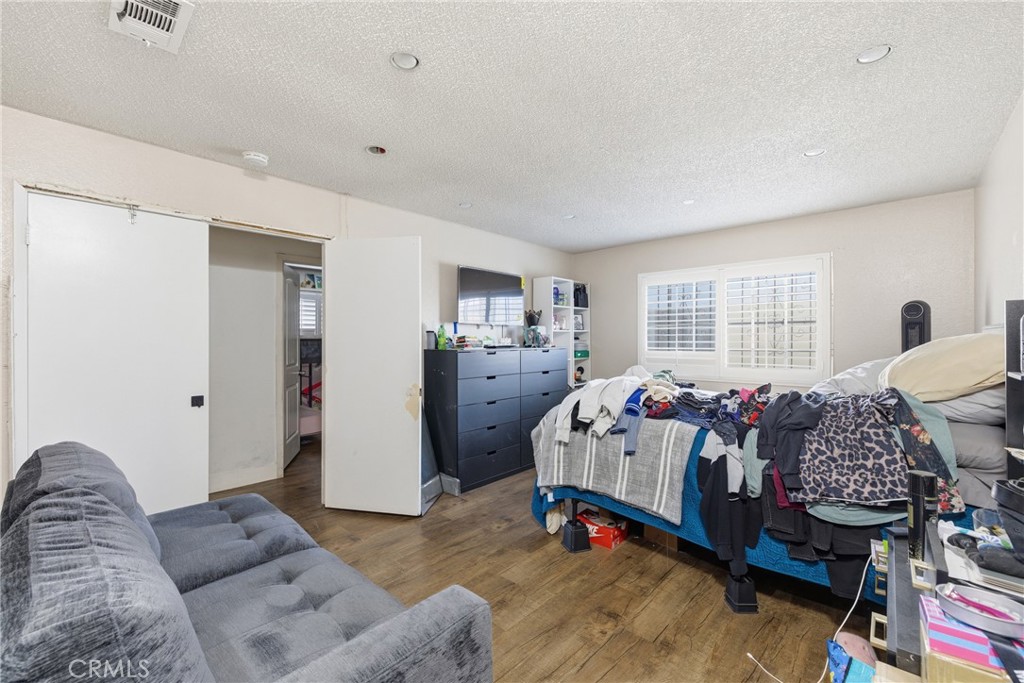 610 South Olive Avenue Rialto, CA 92376 - Photo 20 of 44 a bed room with furniture and a window