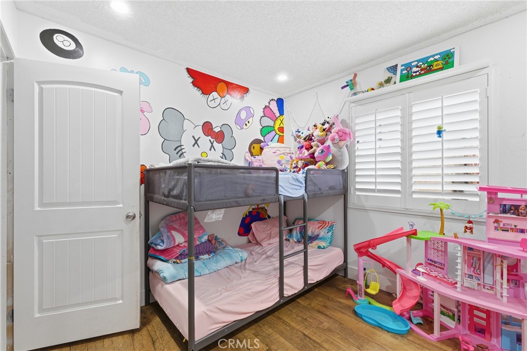 610 South Olive Avenue Rialto, CA 92376 - Photo 24 of 44 a bedroom with lots of baby toys