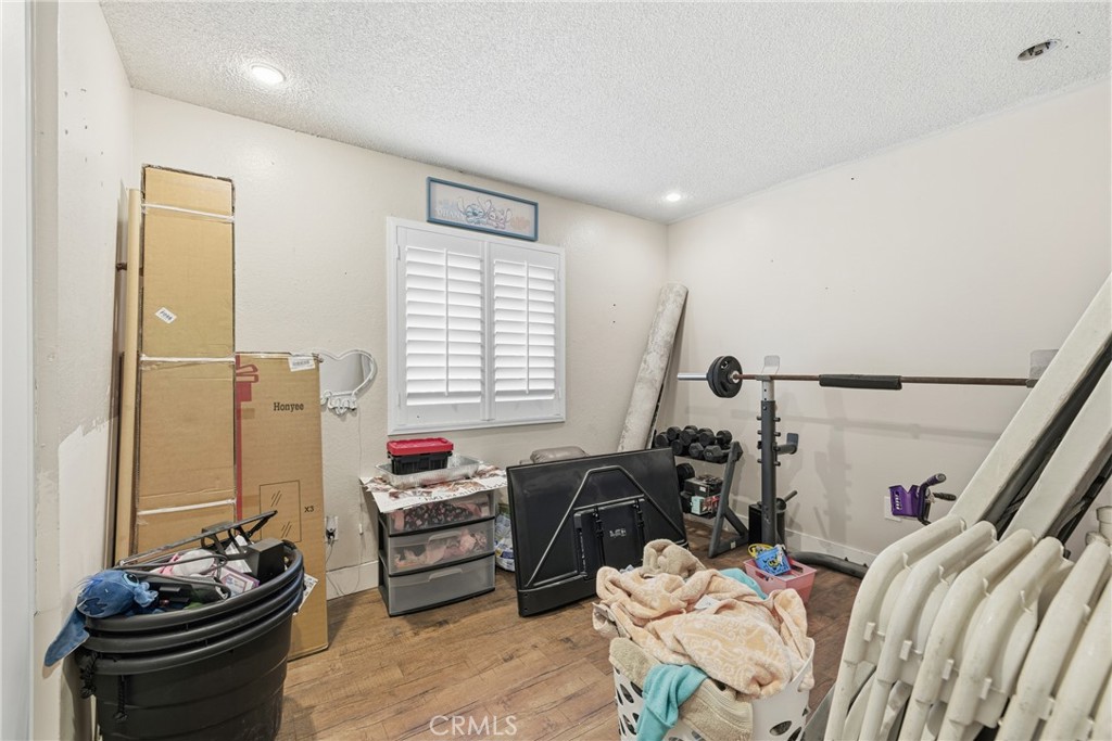 610 South Olive Avenue Rialto, CA 92376 - Photo 25 of 44 a bedroom with furniture and a window