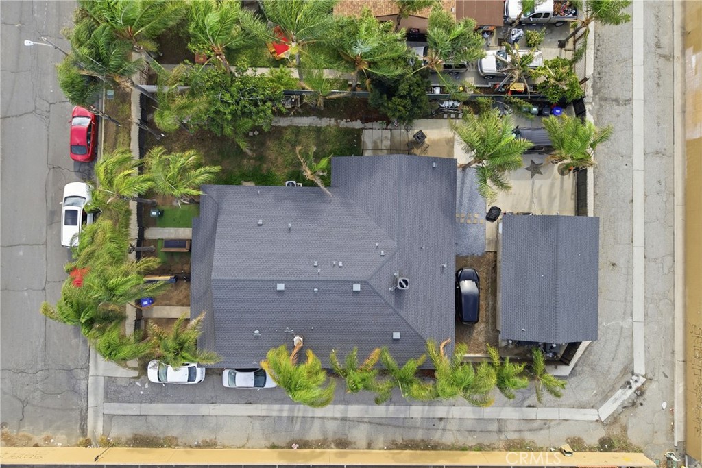 610 South Olive Avenue Rialto, CA 92376 - Photo 32 of 44 an aerial view of a house with a yard and a large tree