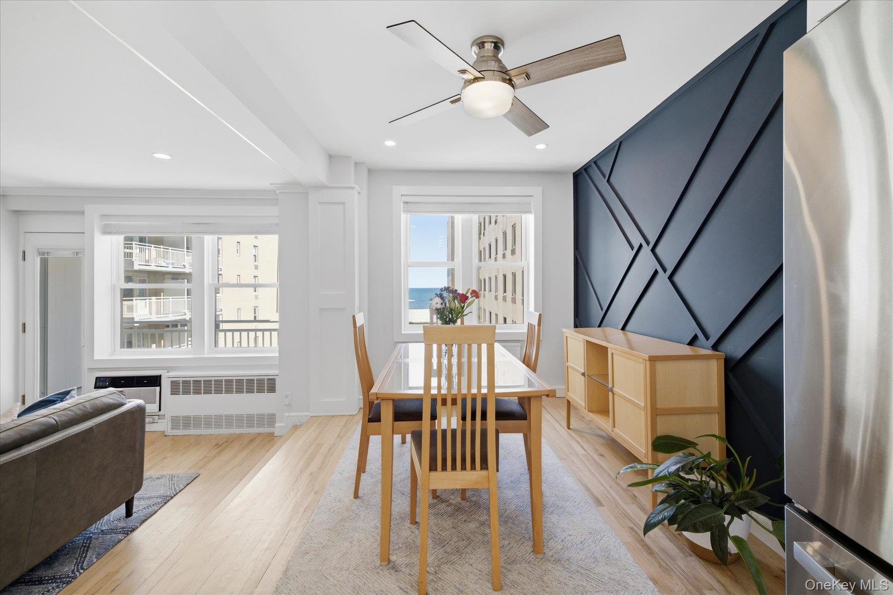 522 Shore Road, Unit 3BB Long Beach, NY 11561 - Photo 7 of 27 Dining area with accent wall and ocean views