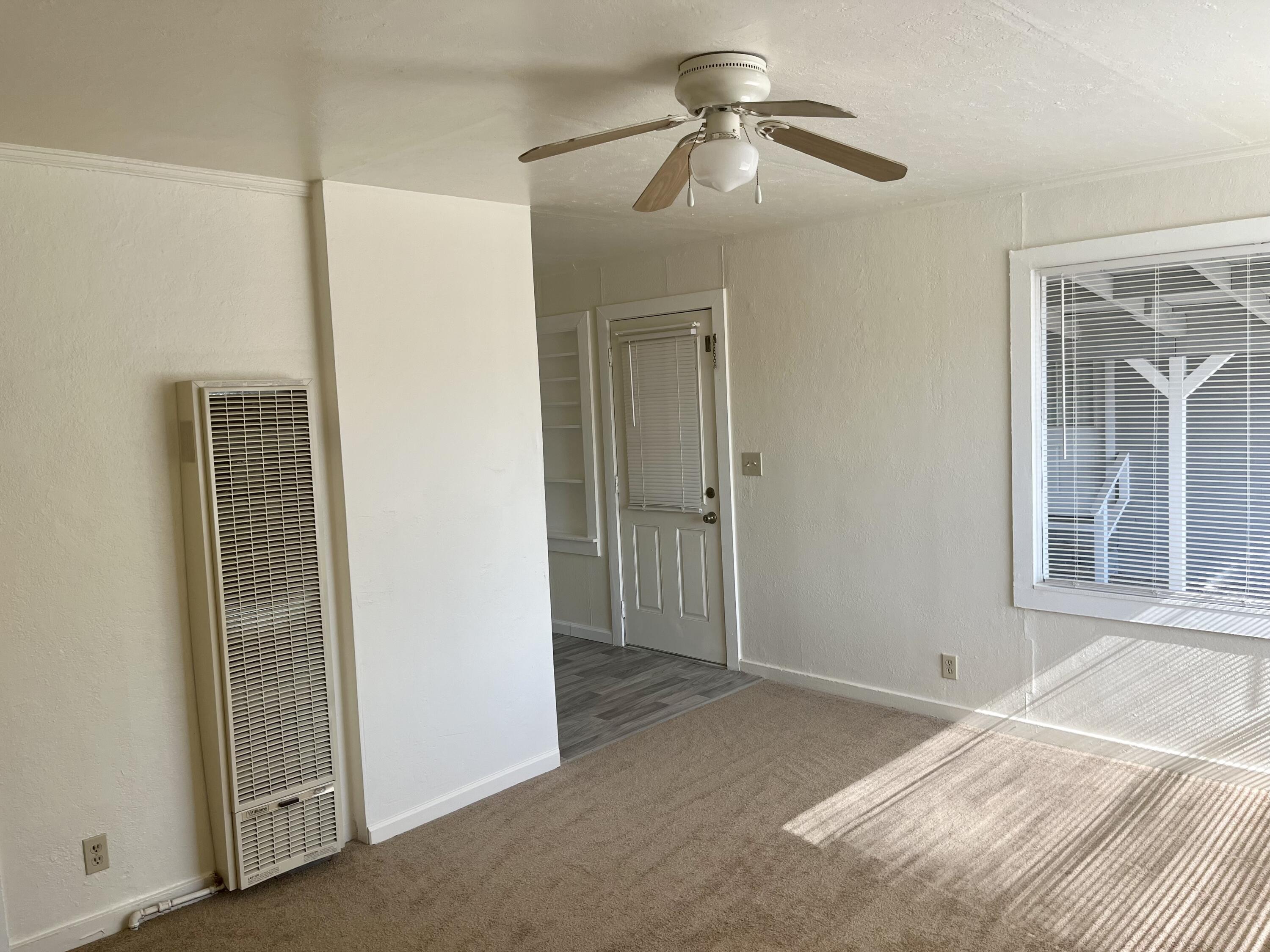 4980-4990 Cedars Road Redding, CA 96001 - Photo 30 of 67 a bedroom with a bed and a window