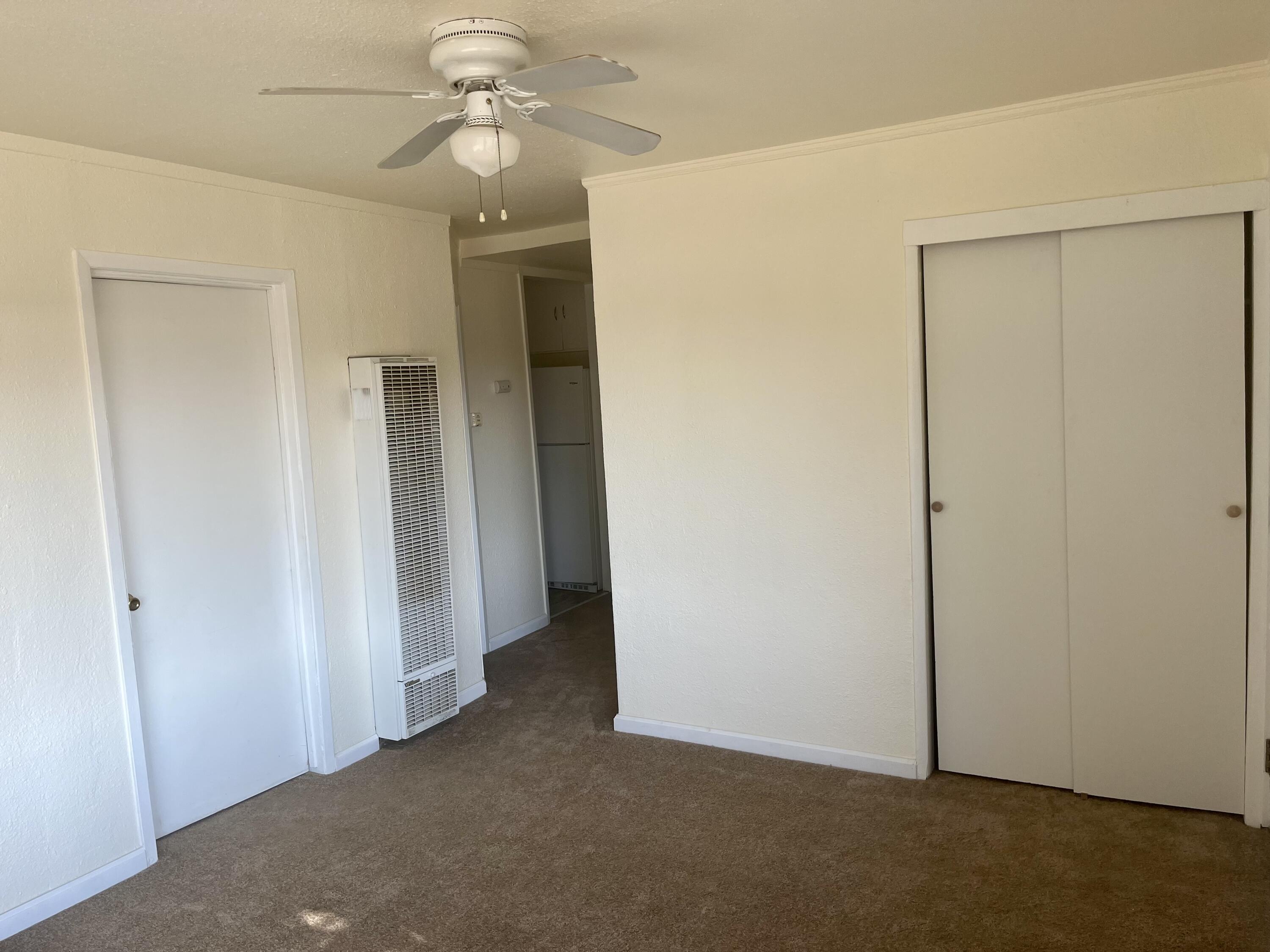 4980-4990 Cedars Road Redding, CA 96001 - Photo 7 of 67 an empty room with closet and a chandelier fan
