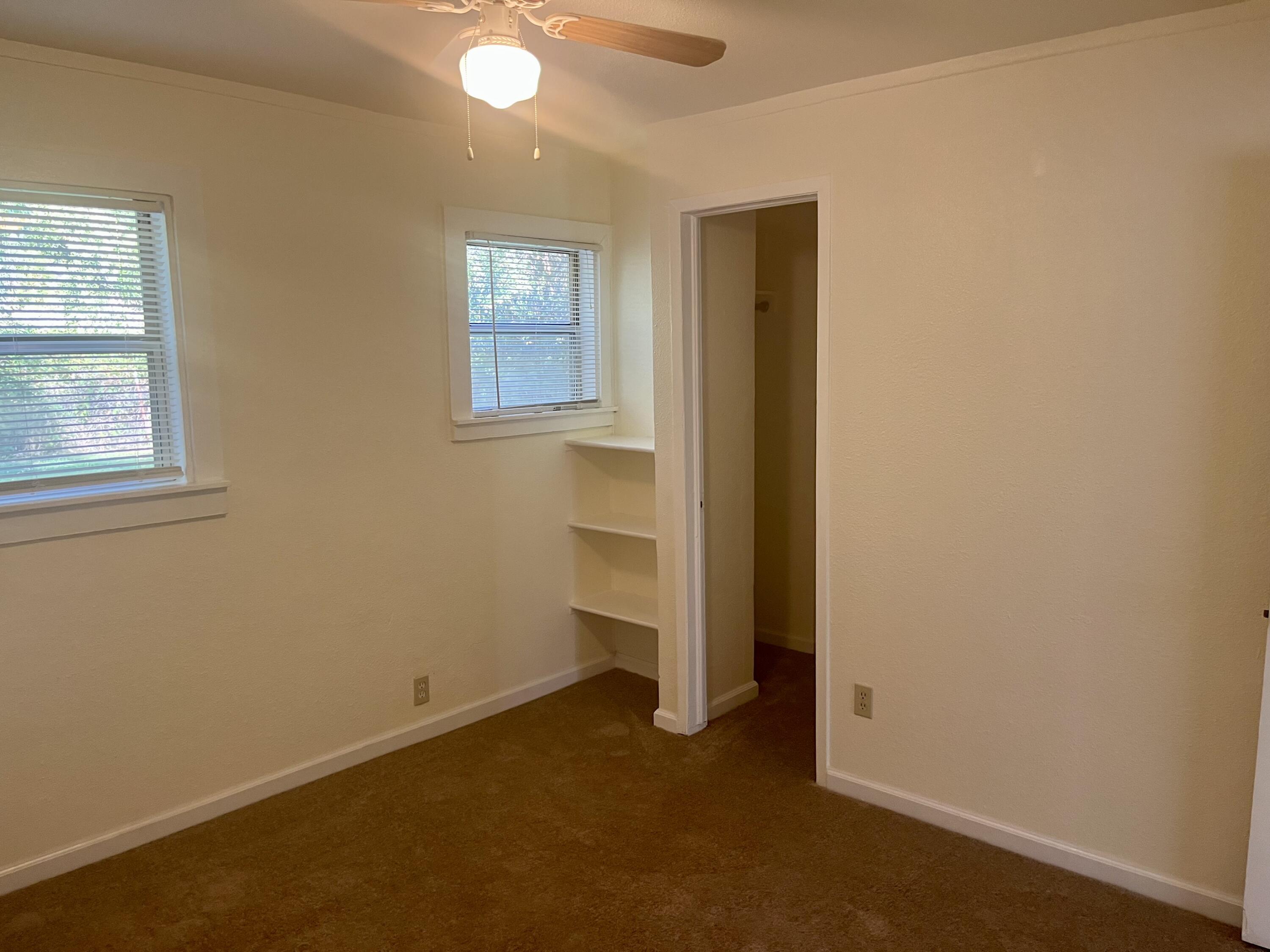 4980-4990 Cedars Road Redding, CA 96001 - Photo 9 of 67 an empty room with windows and closet
